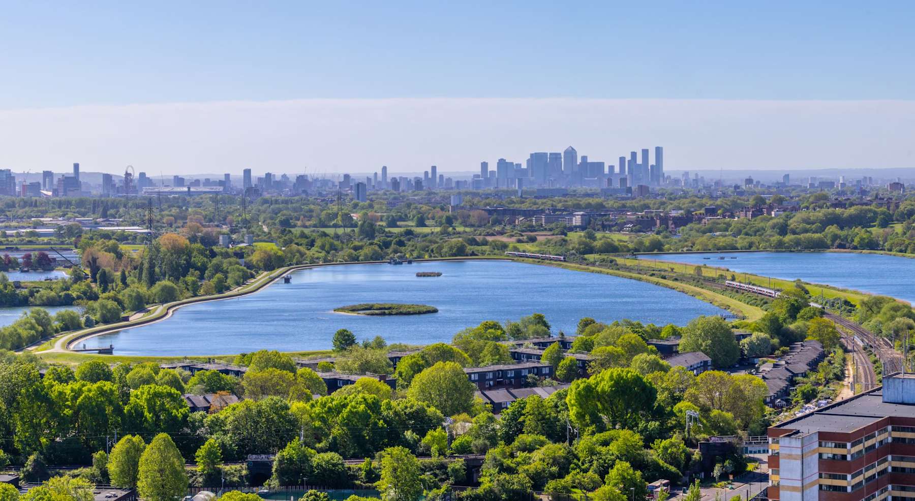 An aerial view of the Walthamstow Wetlands reservoirs from Ferry Island's nineteenth floor terrace